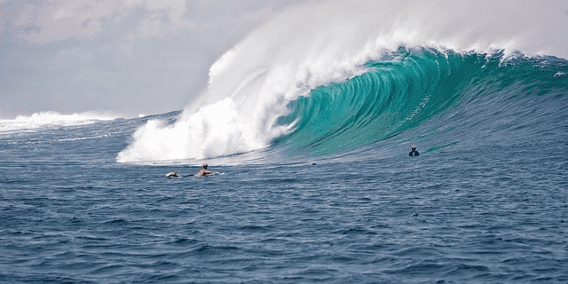 big waves, surfers, indonesia