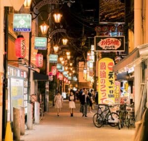 people walking on the street at nighttime