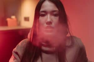 woman releasing smoke